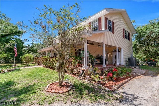 18511 Slater Rd, North Fort Myers, FL 33917 - view of front of property featuring ceiling fan, a front lawn, central air condition unit, and a patio area