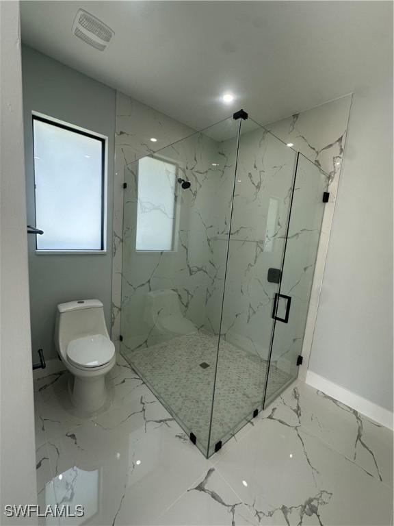 178 Mcarthur Blvd, Lehigh Acres, FL 33974 - full bath featuring marble tiled floors and a marble finish shower