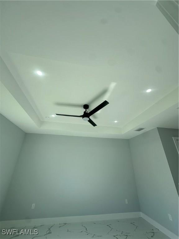 178 Mcarthur Blvd, Lehigh Acres, FL 33974 - detailed view of a tray ceiling, ceiling fan, and recessed lighting