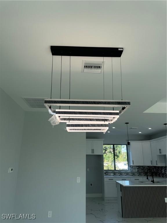 178 Mcarthur Blvd, Lehigh Acres, FL 33974 - detailed view of backsplash and recessed lighting