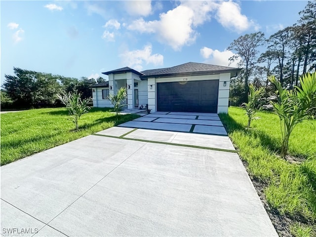 178 Mcarthur Blvd, Lehigh Acres, FL 33974 - ranch-style home with concrete driveway, a garage, a front yard, and stucco siding