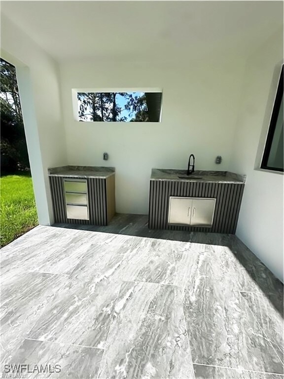 178 Mcarthur Blvd, Lehigh Acres, FL 33974 - unfurnished bedroom featuring multiple windows