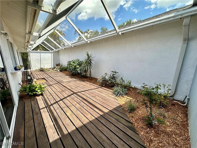 wooden terrace featuring a lanai