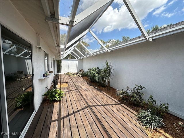 wooden deck with glass enclosure