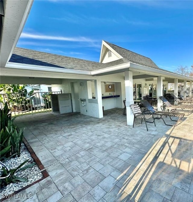 view of patio featuring fence