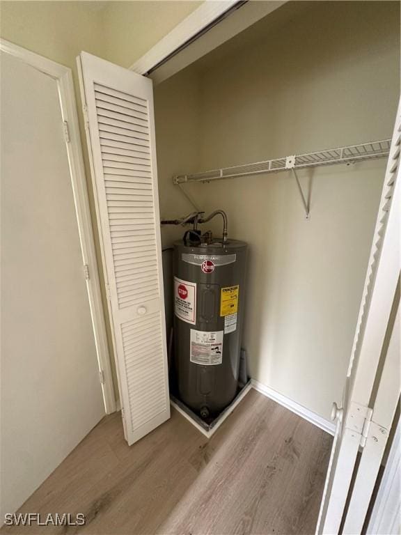 utility room featuring water heater