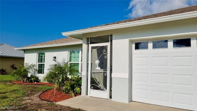 2847 SW 26th Pl, Cape Coral, FL 33914 - view of exterior entry featuring a garage, stucco siding, and a shingled roof