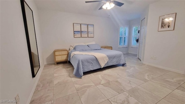 2847 SW 26th Pl, Cape Coral, FL 33914 - bedroom with baseboards, marble finish floor, and ceiling fan