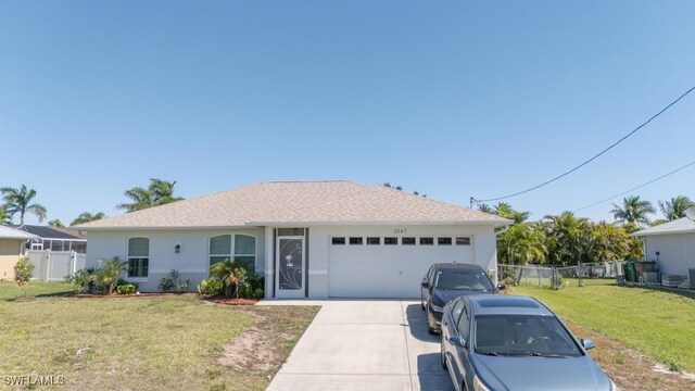 2847 SW 26th Pl, Cape Coral, FL 33914 - ranch-style house with a front lawn, fence, stucco siding, concrete driveway, and an attached garage