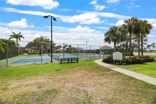 view of community with a tennis court