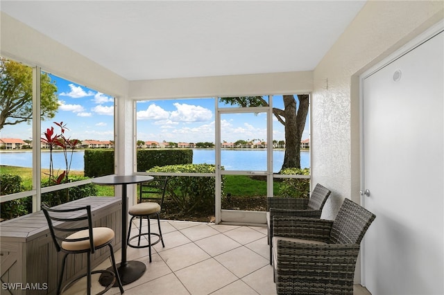 sunroom with a water view