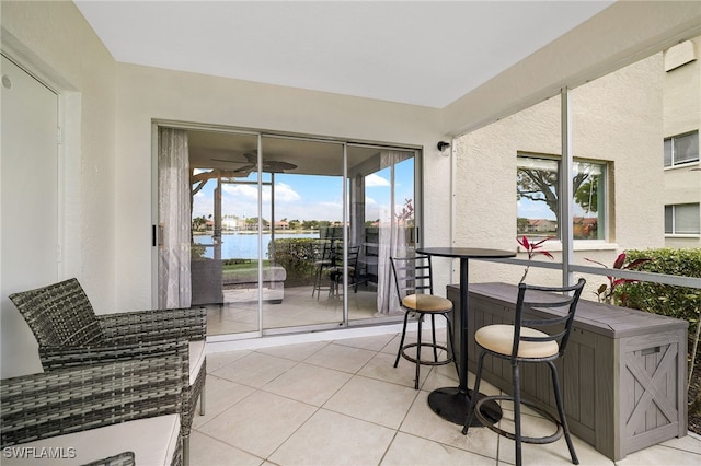 balcony featuring a water view