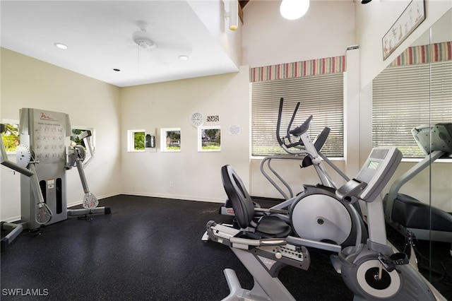 workout area featuring baseboards and recessed lighting