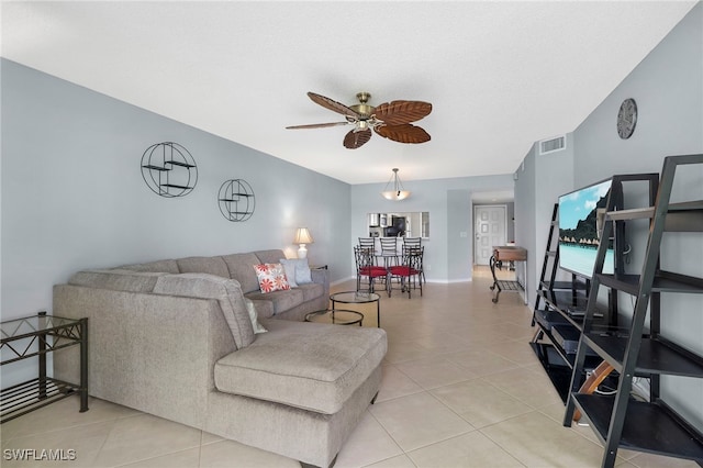 living room with ceiling fan and light tile patterned flooring