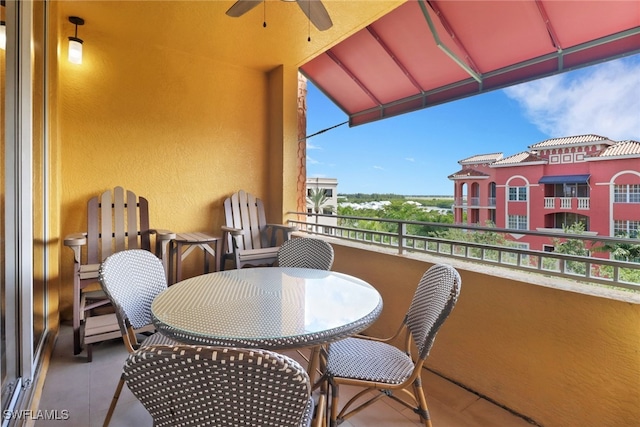 balcony featuring ceiling fan and a sunroom