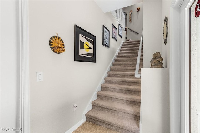 staircase with baseboards