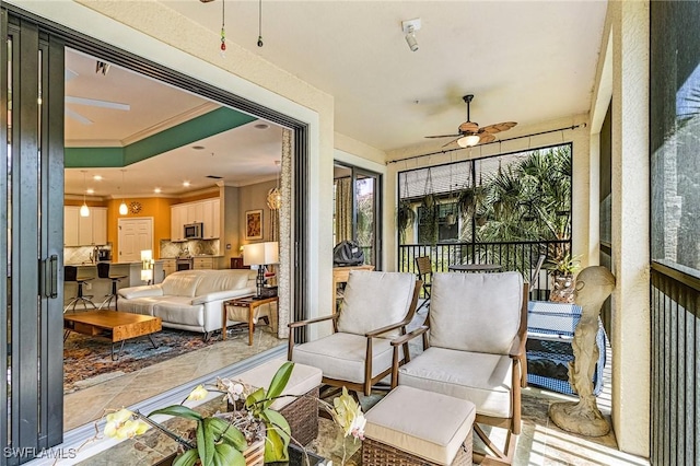 sunroom with a ceiling fan