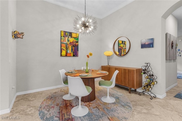 dining room featuring arched walkways, a notable chandelier, ornamental molding, and baseboards