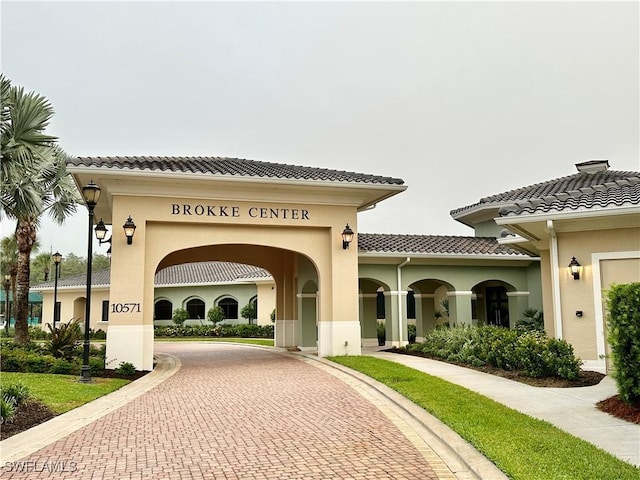 view of property's community with curved driveway