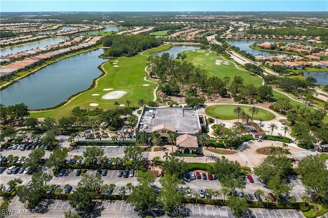 aerial view with a water view, golf course view, and a residential view