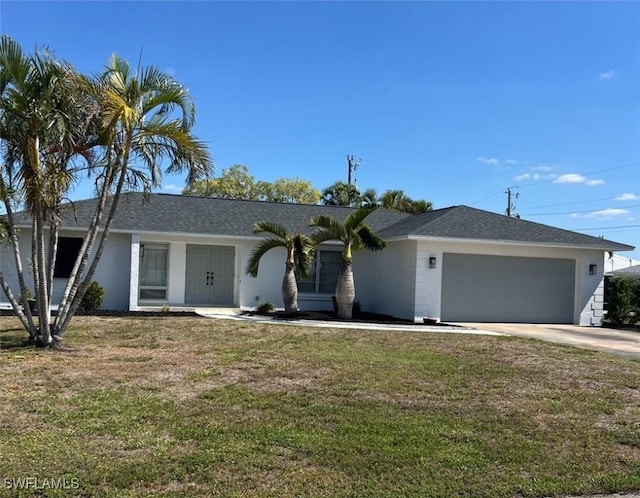 single story home featuring a garage, stucco siding, a front yard, and concrete driveway