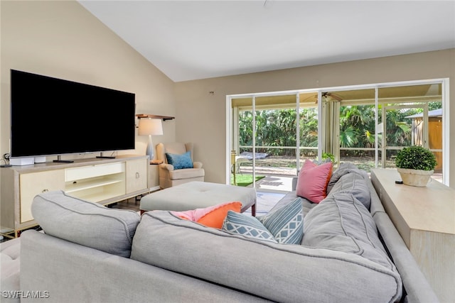 living room featuring vaulted ceiling