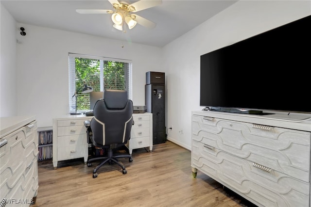 office space featuring light wood-style flooring and a ceiling fan