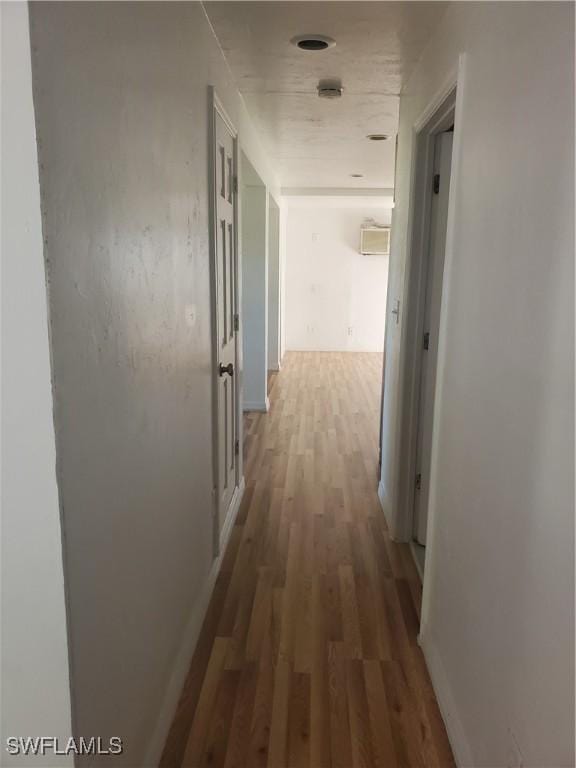 hall featuring wood finished floors