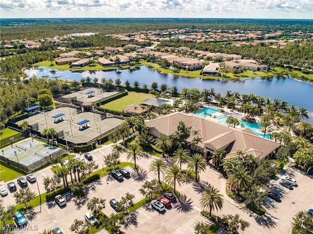 drone / aerial view featuring a water view and a residential view