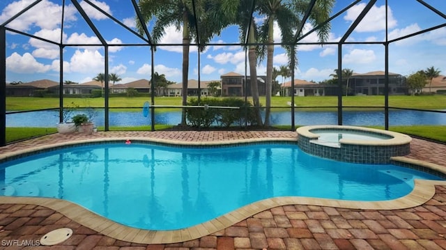 view of swimming pool with a residential view, a pool with connected hot tub, and a lanai