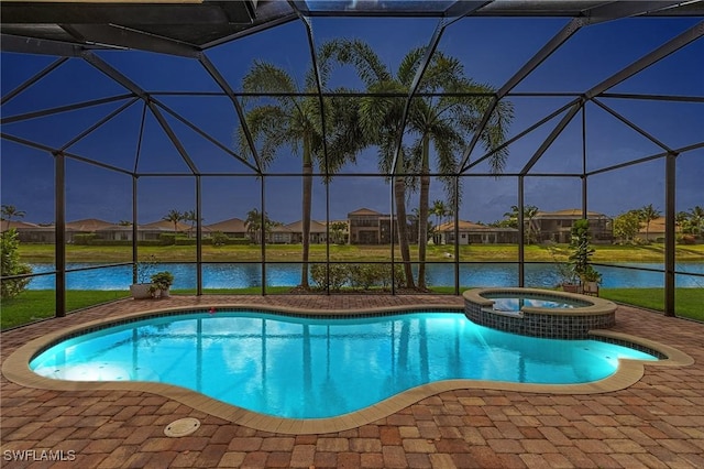 3454 Pacific Dr, Naples, FL 34119 - view of swimming pool with glass enclosure, a patio, and a water view