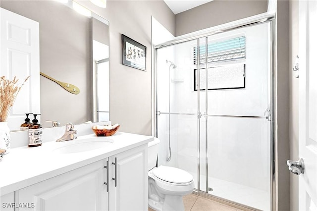 3454 Pacific Dr, Naples, FL 34119 - full bath featuring a stall shower, toilet, vanity, and tile patterned flooring