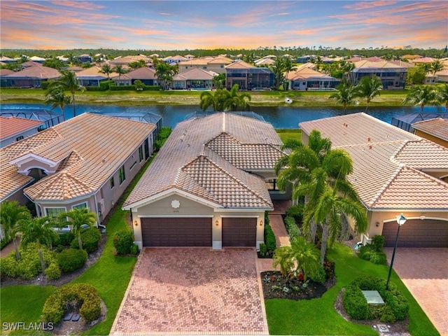 3454 Pacific Dr, Naples, FL 34119 - aerial view at dusk of a residential view and a water view