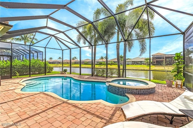 3454 Pacific Dr, Naples, FL 34119 - view of pool featuring a patio area, a water view, a pool with connected hot tub, and glass enclosure