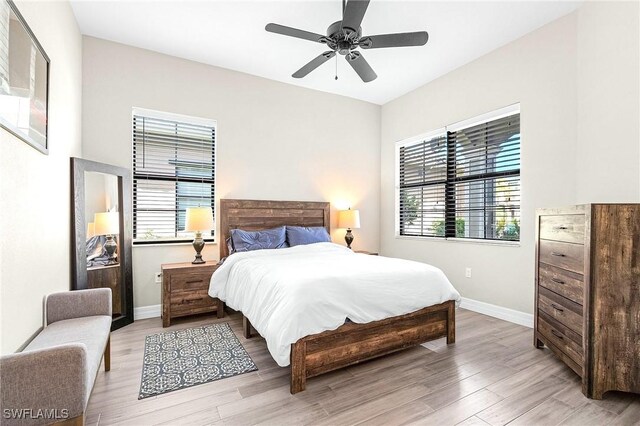 3454 Pacific Dr, Naples, FL 34119 - bedroom featuring light wood-style floors, baseboards, and a ceiling fan