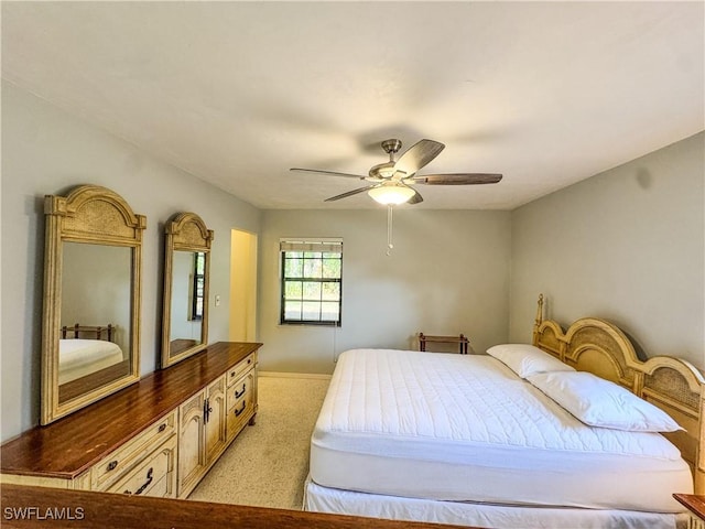 75 Hardee St, Labelle, FL 33935 - bedroom with light colored carpet, ceiling fan, and baseboards