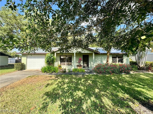 75 Hardee St, Labelle, FL 33935 - ranch-style home featuring concrete driveway, stucco siding, a front lawn, and an attached garage