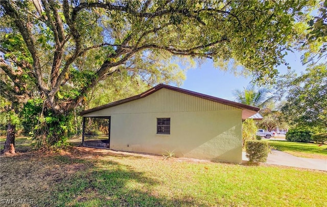 75 Hardee St, Labelle, FL 33935 - view of home's exterior featuring a lawn and stucco siding