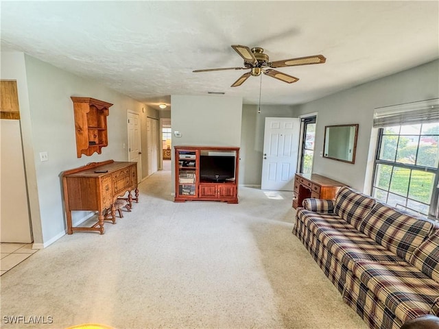 75 Hardee St, Labelle, FL 33935 - living area with ceiling fan, light carpet, and baseboards
