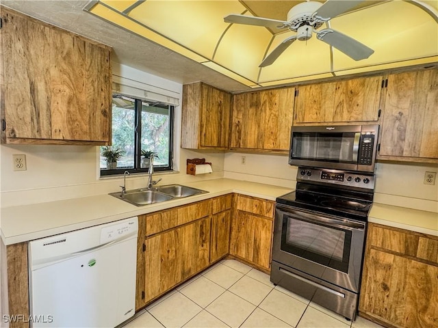 75 Hardee St, Labelle, FL 33935 - kitchen featuring stainless steel appliances, a sink, light countertops, and a ceiling fan