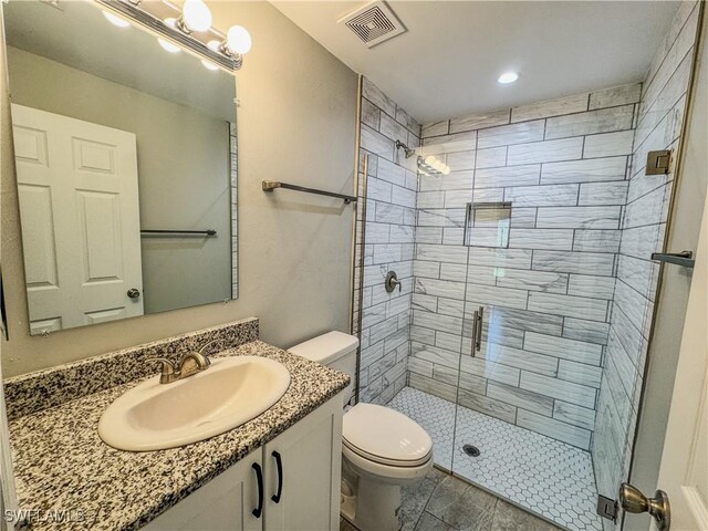 168 Village Cir Unit 9, Labelle, FL 33935 - full bath with toilet, a stall shower, vanity, and recessed lighting