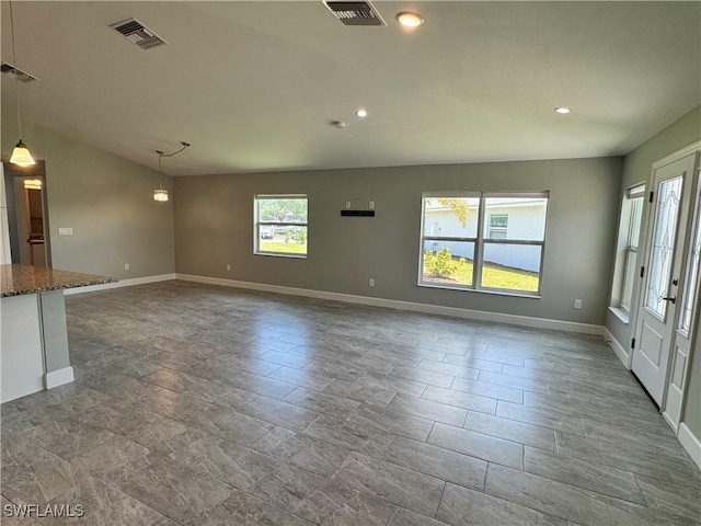 168 Village Cir Unit 9, Labelle, FL 33935 - unfurnished living room with baseboards and recessed lighting