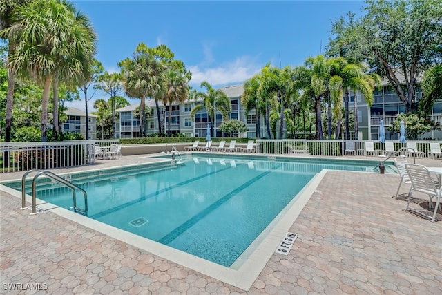 512 Sugar Pine Ln Unit 512, Naples, FL 34108 - pool with fence and a patio