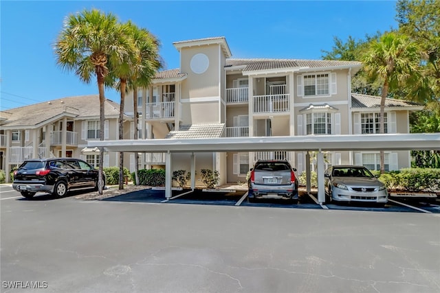 512 Sugar Pine Ln Unit 512, Naples, FL 34108 - view of building exterior with covered parking
