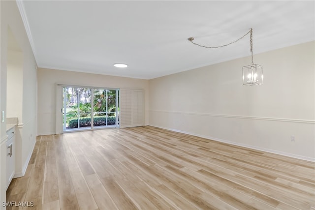 512 Sugar Pine Ln Unit 512, Naples, FL 34108 - interior space featuring light wood finished floors, an inviting chandelier, and baseboards