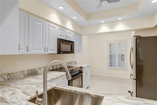 512 Sugar Pine Ln Unit 512, Naples, FL 34108 - kitchen featuring freestanding refrigerator, recessed lighting, black microwave, and electric stove