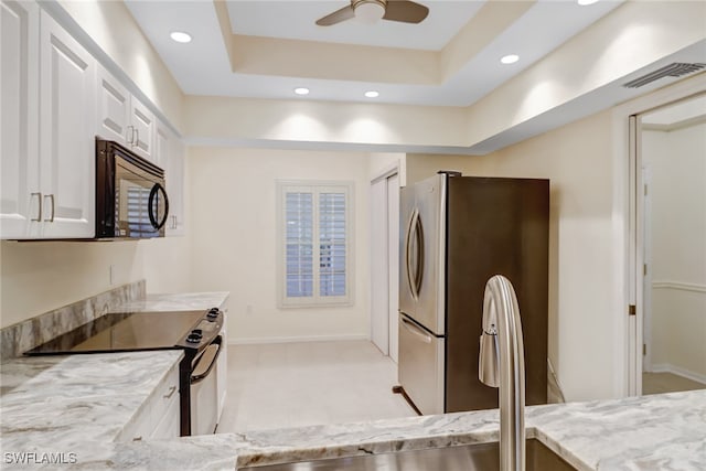 512 Sugar Pine Ln Unit 512, Naples, FL 34108 - kitchen with stainless steel appliances, visible vents, recessed lighting, white cabinetry, and light stone countertops