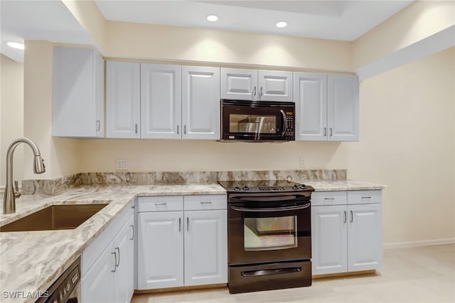 512 Sugar Pine Ln Unit 512, Naples, FL 34108 - kitchen with white cabinetry, black appliances, light stone countertops, and a sink