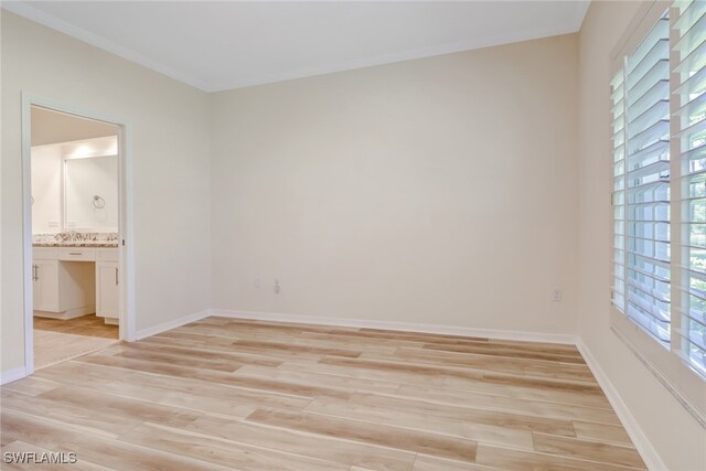 512 Sugar Pine Ln Unit 512, Naples, FL 34108 - unfurnished bedroom featuring light wood-style flooring and multiple windows