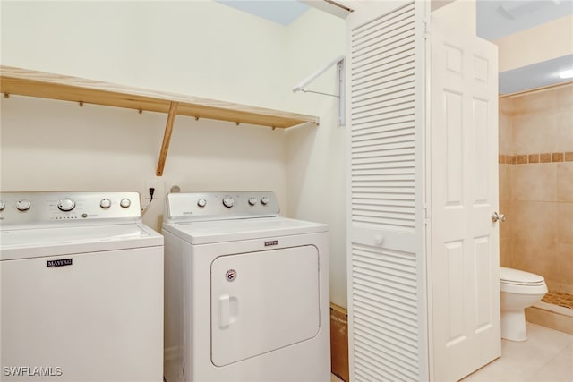 512 Sugar Pine Ln Unit 512, Naples, FL 34108 - clothes washing area with laundry area, washer and clothes dryer, and light tile patterned floors
